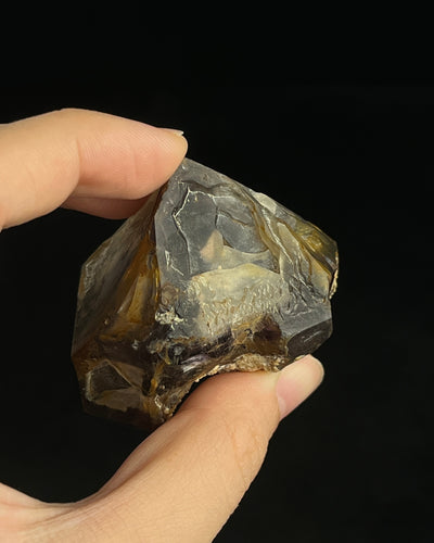 Natural Namibian skeletal amethyst specimen with etched “mountain” formations and smoky-violet zoning.6