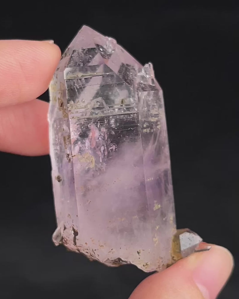 Soft lavender amethyst with self-healed regrowth crystals and a light chlorite coating near the base.video