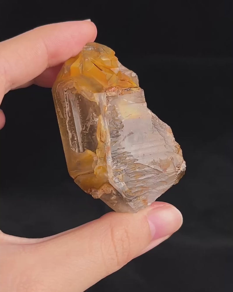 Golden-brown elestial quartz with high clarity, natural etched cavity, and cloud-like surface etching.video