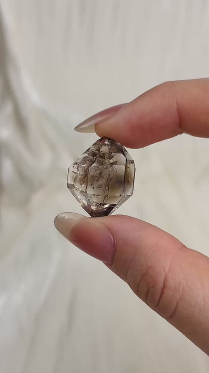 Champagne-colored Chongqing Diamond Quartz with two Isis faces and skeletal surface texture from China video