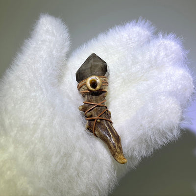 Smoky Quartz Antler Wand with Record Keeper crystal resting in a white glove