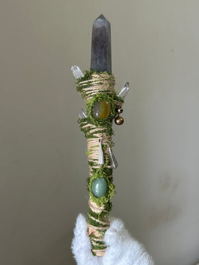 Back view of forest-themed birch wand with grounding crystals