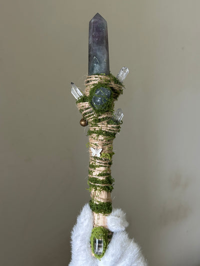 Front view of birch wand with green fluorite tip and crystal cluster