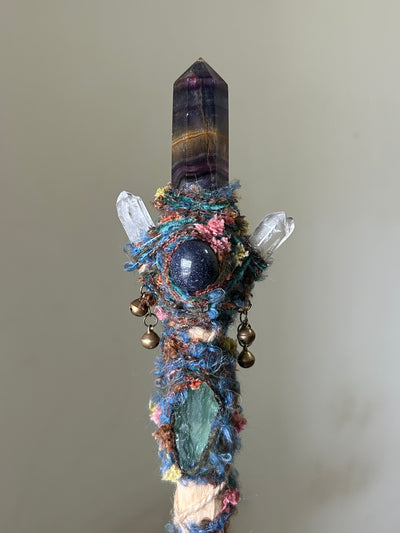 Close-up of rainbow fluorite point with blue lace and quartz crystal details
