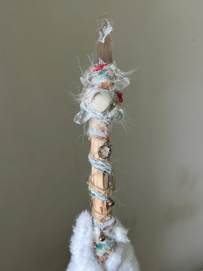 Front view of birch wand with sakura agate tip and pastel thread wrap