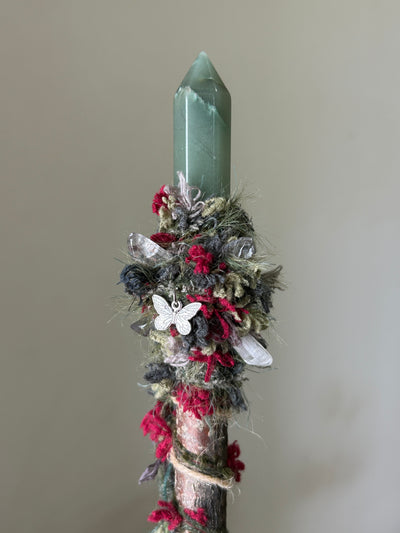 Close-up of aventurine point and floral red fiber accents