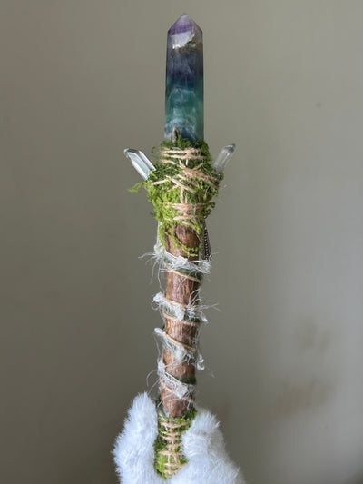 Back view of willow wand with soft fibers and butterfly charm