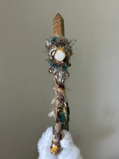 Front view of willow wand with picture jasper point and yellow calcite accent