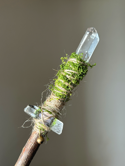 Close-up of the quartz tips, moss, and twine wrapping on a willow wand